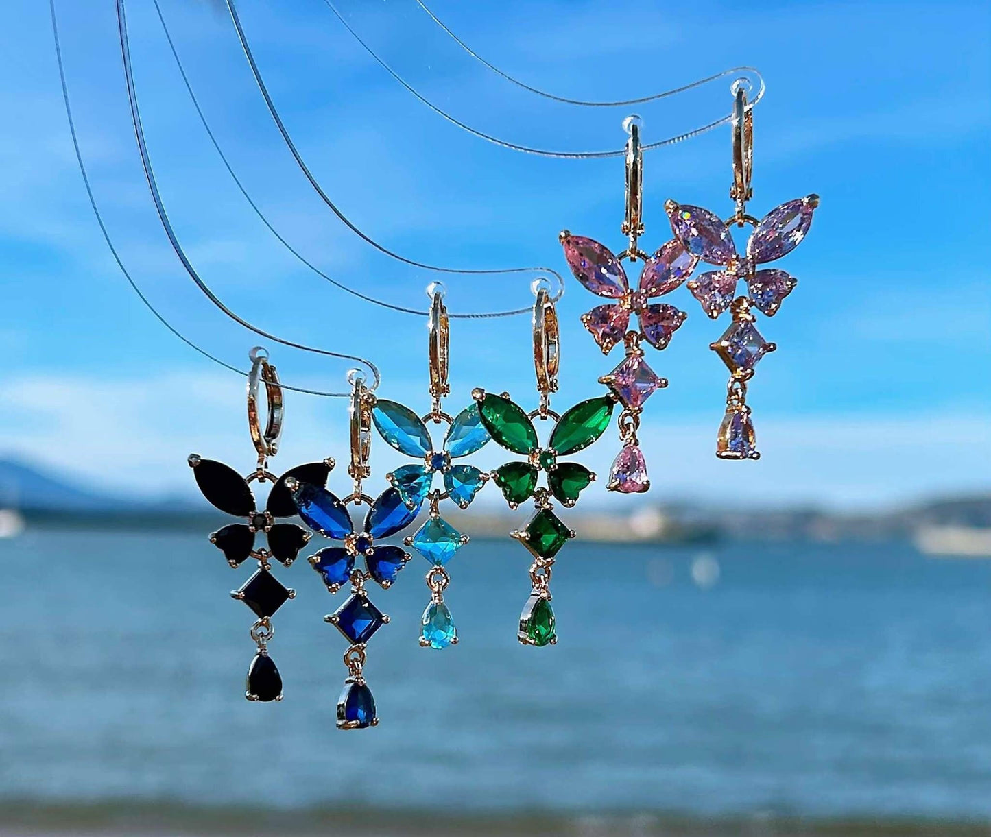 dainty dangle butterfly earrings in six different colors, pink, purple, green, blue, sapphire, black
