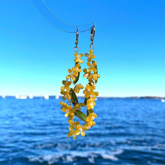 a pair of yellow beaded yellow flower